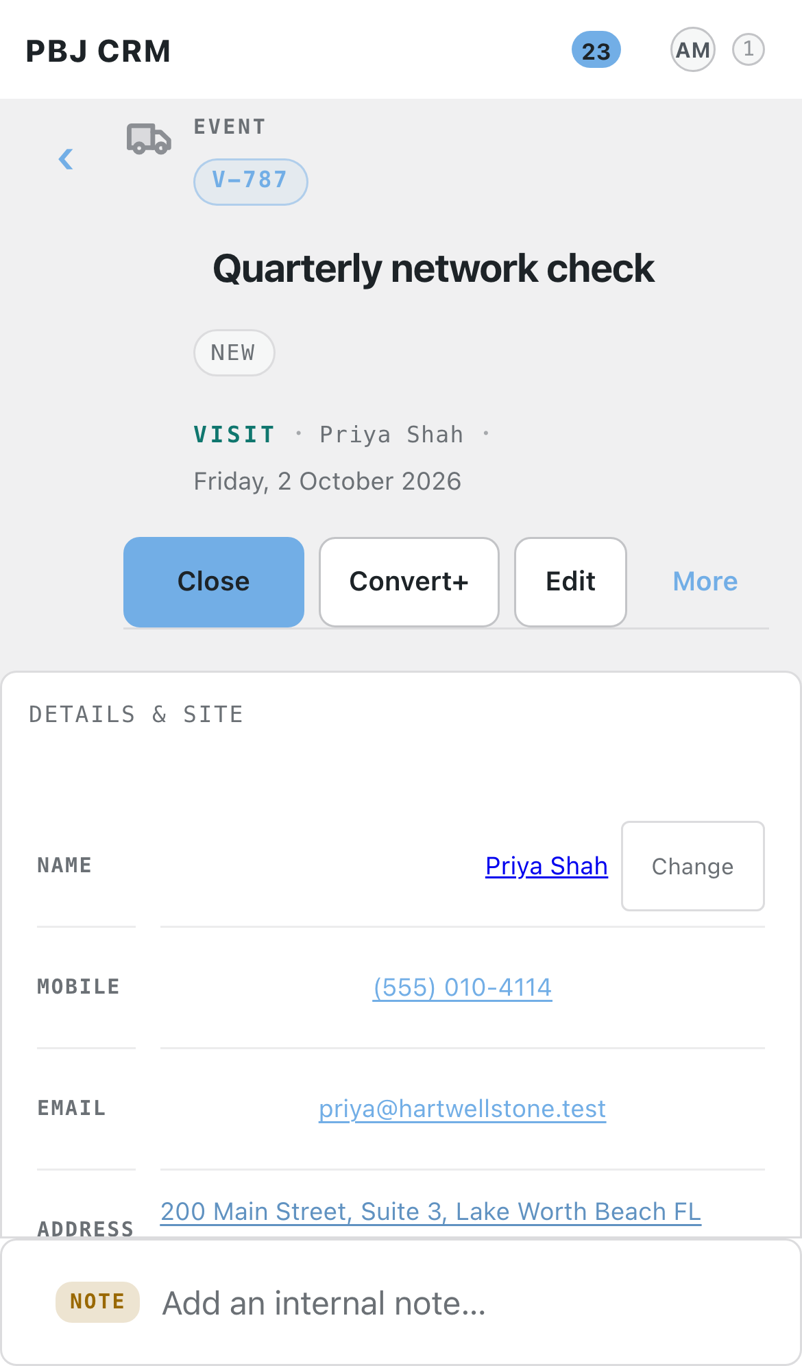 A visit record in PBJ CRM on a phone, showing the title, the site contact name, mobile number and email